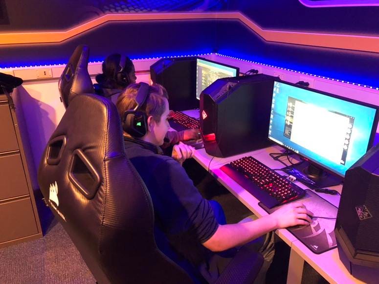Bri Harris and Aaron Frick play "League of Legends" at Canisius College esports lab. October 26, 2018 (WBEN Photo/Mike Baggerman)